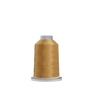 May include: A spool of golden-colored thread. The thread is tightly wound around a cylindrical core with a white base and a gray top. The thread has a slight sheen, suggesting a smooth texture.