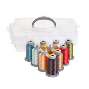 May include: A clear plastic storage case with a handle, containing 10 spools of thread in various colors, including teal, light blue, beige, peach, brown, red, and green.