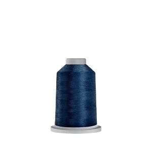 May include: A dark blue thread spool, ideal for sewing or embroidery. The thread is a rich, deep blue colour, and the spool has a white base and a grey top. The thread appears to be smooth and of high quality.