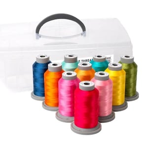 May include: A clear plastic storage case with a black handle holds a collection of colorful spools of thread. The thread colors include blue, orange, pink, red, yellow, green, and teal. The spools are arranged in a fan shape.