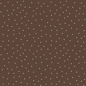 May include: A brown background with a white polka dot pattern.