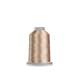 May include: A spool of light tan metallic thread. The thread is wound around a cylindrical core with a grey top and base. The thread has a subtle sheen, suggesting a smooth texture, and is suitable for sewing and embroidery projects.