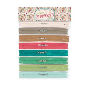 May include: A package of eight 16-inch Happy Zippers in various colors, including cream, gray, brown, red, teal, green, and light blue. The package has a decorative header with the text "Happy Zippers 3".