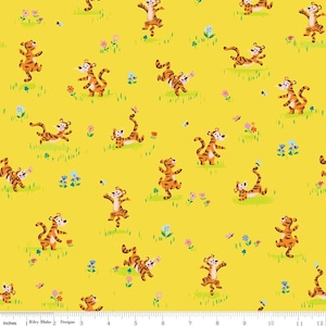 May include: A yellow fabric with a repeating pattern of orange and black tigers playing in a field of green grass and flowers. The tigers are in various poses, some are jumping, some are running, and some are playing with butterflies. The fabric is perfect for quilting, sewing, and crafting.