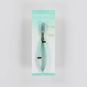 May include: A package for a pair of blue and silver sharp snips with a micro serrated blade. The package is labelled "Kimberbell Sharp Snips 2" right-handed & Left-handed".