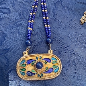 Vintage Lapis lazuli bead and stone pendant.