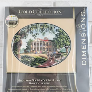 May include: A Dimensions Gold Collection counted cross stitch kit. The package features an oval image of a Southern mansion with a horse-drawn carriage. The kit measures 40.6 cm x 30.4 cm.