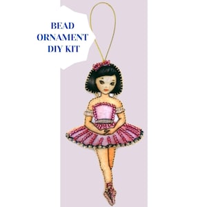May include: A beaded ornament DIY kit featuring a ballerina doll with a pink tutu and black hair. The kit includes all the beads and instructions needed to create the ornament.