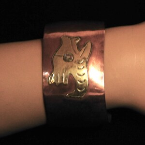 Mexican copper and brass bracelet with abalone--Quetzalcoatl maybe?