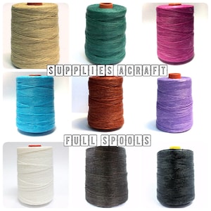 May include: Full spools of waxed cotton thread in various colours, including beige, teal, pink, blue, orange, purple, white, grey, and black. SUPPLIES A CRAFT FULL SPOOLS