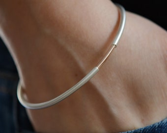 Rose gold bracelet bangle in modern design, solid sterling silver bangle with oval contour and rose gold accent, handmade minimalist jewelry