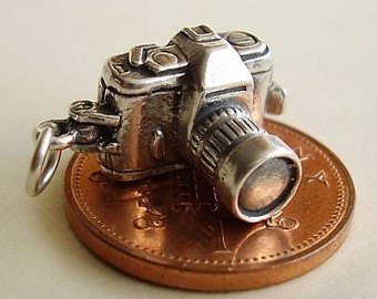 Sterling silver CAMERA charm..Opening reveals an image of couple holding hands