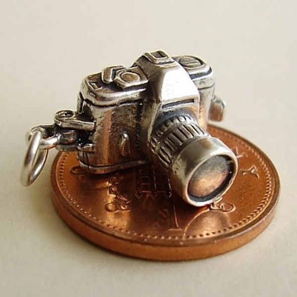 Sterling silver CAMERA charm..Opening reveals an image of couple holding hands