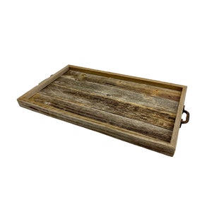 May include: A rustic wooden tray with a natural wood finish and metal handles. The tray is made from reclaimed wood and has a unique, weathered look.