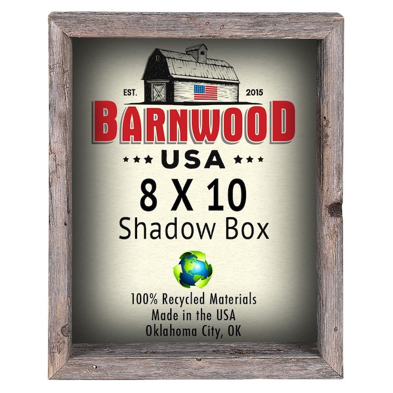 May include: A rustic wooden shadow box frame with a white background and red text that reads "BARNWOOD *** USA *** 8 X 10 Shadow Box". The frame is made from 100% recycled materials and is made in the USA. The text also includes "EST. 2015" and a small image of a red barn with an American flag.