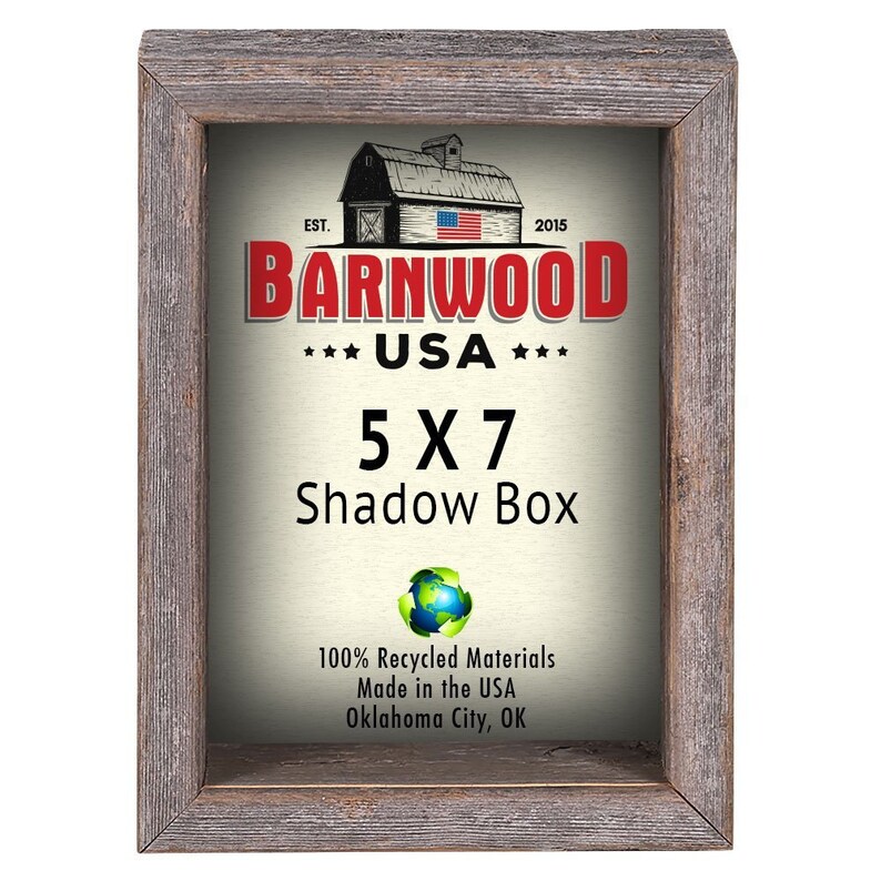 May include: A rustic wood shadow box frame with a white background and the text "BARNWOOD USA 5X7 Shadow Box 100% Recycled Materials Made in the USA Oklahoma City, OK".
