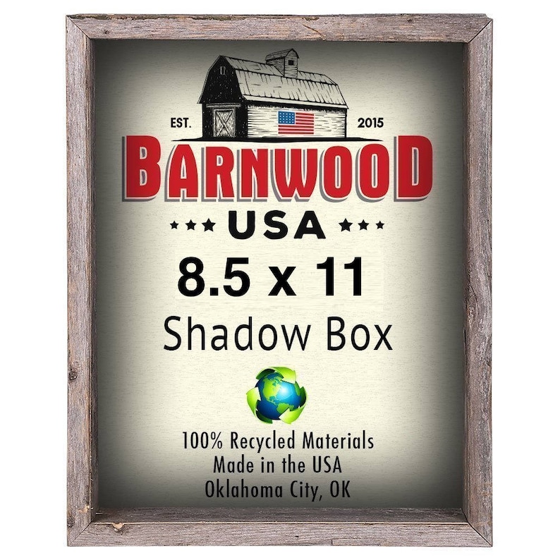 May include: A rustic wooden shadow box frame with a red, white, and blue barnwood logo. The logo says "Barnwood" with "USA" and "8.5 x 11" underneath. The frame is made from 100% recycled materials and is made in the USA.