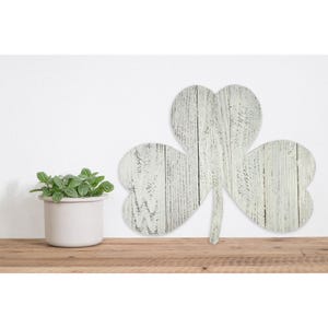 May include: Whitewashed wooden shamrock cutout with a distressed finish. The shamrock is a traditional Irish symbol of good luck.