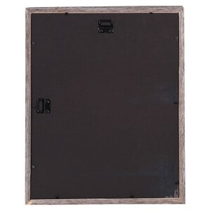 May include: A gray wood picture frame with a black mat and two metal hanging hooks on the back.
