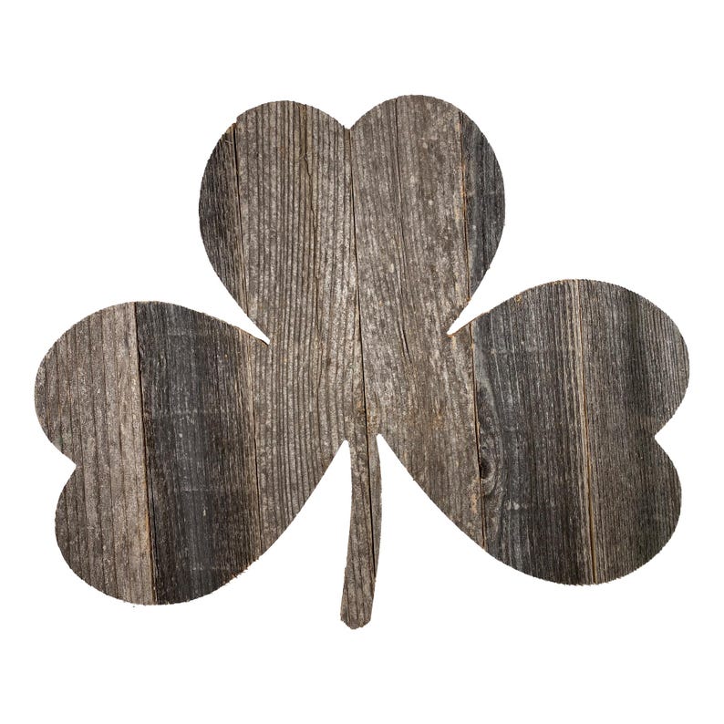May include: A rustic wooden shamrock cutout with a distressed gray finish. The shamrock is made of reclaimed wood and has a natural, weathered look.