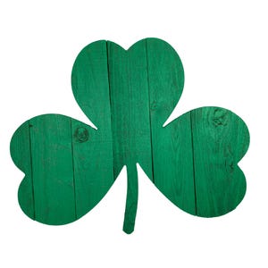 May include: Green wooden shamrock cutout with a distressed finish.