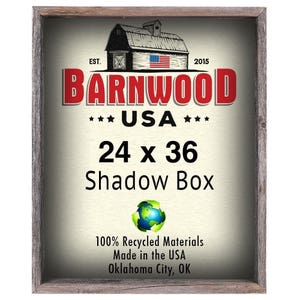 May include: A rustic wooden frame with a white background and the text "BARNWOOD *** USA *** 24 x 36 Shadow Box 100% Recycled Materials Made in the USA Oklahoma City, OK".