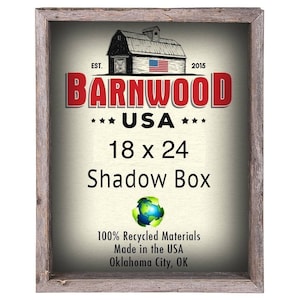May include: A rustic wooden shadow box frame with a white background and red, white, and blue barnwood logo. The logo reads "Barnwood USA" and "18 x 24 Shadow Box". The frame is made from 100% recycled materials and is made in the USA.