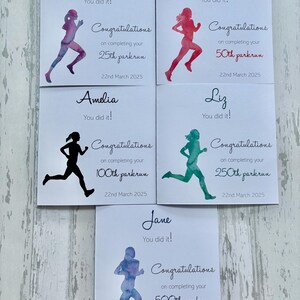 May include: A set of congratulatory cards with running figures in different colours. Each card says "You did it!" and "Congratulations" for completing a parkrun, with milestones from 25th to 500th, dated March 22, 2025.