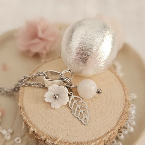 Brushed silver pregnancy bola with mother-of-pearl flower and moonstone on steel chain