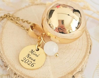 Mini Nous 2026 gold pregnancy bola with moonstone on a gold chain