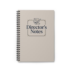 May include: A spiral-bound notebook with a beige cover featuring the text "Director's Notes" in navy blue, framed by a decorative border and a theater-themed graphic. The notebook's binding is black.