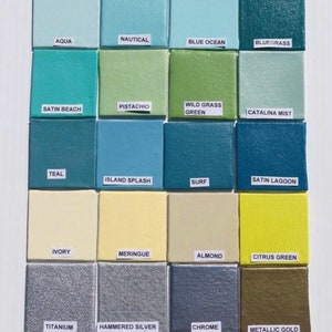 May include: A color chart with 16 paint swatches, each labeled with a color name. The colors include aqua, nautical, blue ocean, bluegrass, pistachio, satin beach, wild grass green, catalina mist, teal, island splash, surf, satin lagoon, ivory, meringue, almond, citrus green, titanium, hammered silver, chrome, and metallic gold.