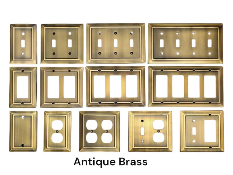 May include: Antique brass electrical wall plates in various sizes and configurations, including single, double, triple, and quad switch plates, as well as outlet plates.  The plates have a decorative, slightly raised border.