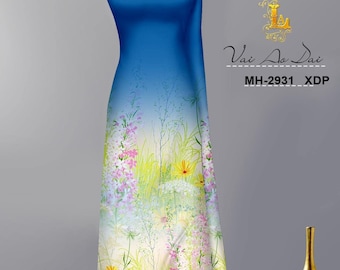 May include: A blue and white fabric with a floral print. The fabric has a gradient from blue to white and features a variety of flowers in shades of pink, yellow, and blue. The fabric is displayed on a mannequin. The text "Vai Ao Dai" and "MH-2931_XDP" is printed on the fabric.