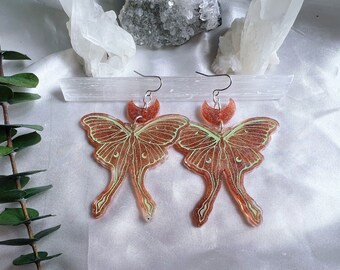 Glittery peach and green lunar moth earrings