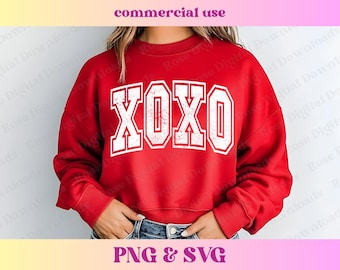 May include: Red sweatshirt with a white XOXO graphic in a vintage style font. The sweatshirt is cropped and has long sleeves.