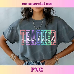 May include: A gray t-shirt with the text "TEACHER mrs. bond" in rainbow colors.