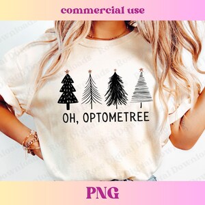 May include: A white t-shirt with a black and white illustration of five Christmas trees with gold stars on top. The text "OH, OPTOMETREE" is printed below the trees.