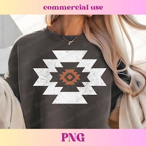 May include: A dark grey sweatshirt with a white geometric design featuring a distressed look. The design is a stylised pattern of squares and diamonds with a smaller orange square in the centre.