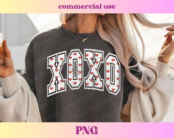 May include: A dark gray sweatshirt with a white graphic print of the word "XOXO" surrounded by small red hearts.