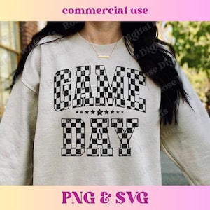May include: A white sweatshirt with a black and white chequered design that says "GAME DAY".