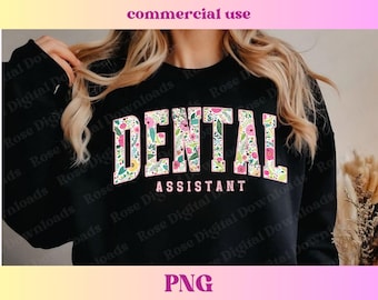 May include: Black sweatshirt with a floral design that says "DENTAL ASSISTANT" in pink letters.