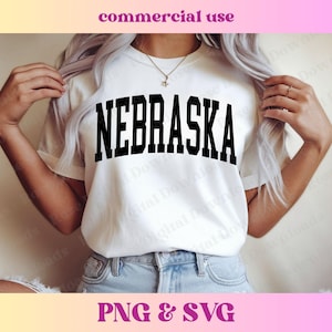 May include: White t-shirt with the word "NEBRASKA" in bold, black, collegiate-style lettering. The shirt is short-sleeved and appears to be made of a soft material. The image also includes the text "commercial use" and "PNG & SVG".