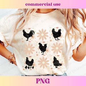 May include: A white t-shirt with a graphic design of black silhouettes of chickens and daisies in a repeating pattern. The design is in a retro style.