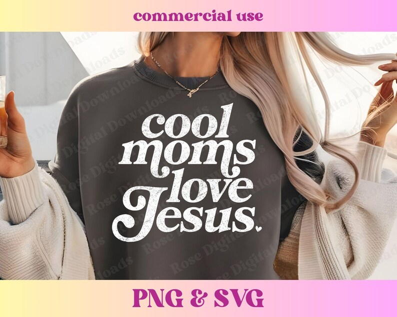 May include: A dark gray sweatshirt with the text "cool moms love Jesus." in white, retro-style lettering. The sweatshirt is worn by a person with long blonde hair.