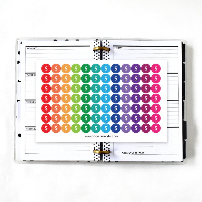 May include: A sheet of rainbow coloured dollar sign stickers. The stickers are arranged in a grid pattern and are perfect for use in a planner or journal.