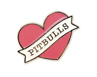 May include: Pink enamel heart with a white banner that says "PITBULLS" in gold lettering.