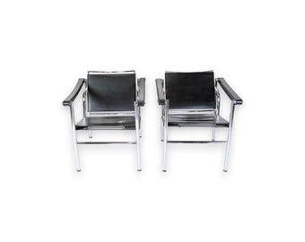 Set Of Two Model LC1 Armchairs In Black Leather & Steel By Le Corbusier