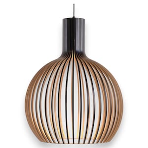 May include: A spherical pendant light fixture featuring a series of vertical black slats arranged around a central white cylindrical core. The design creates a cage-like appearance with alternating black lines and light-colored gaps throughout the body.