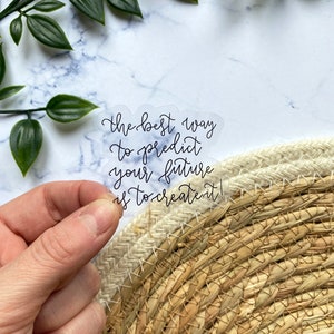May include: Clear sticker with the quote "The best way to predict your future is to create it!"